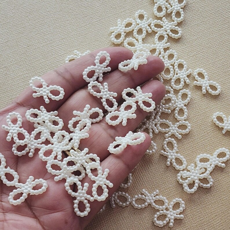 Tiny White Pearl Bow Embellishment for Wedding Invitations, Scrapbook Journals, Baby Shower Decor, Minimalist Handmade Craft Accent, Elegant Plastic Beaded Bow for Card Making, Gift Wrapping, and Accessories