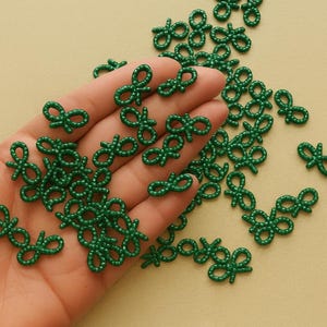 Festive Bow Collection Christmas Pearl Embellishment Holiday Craft Supply Small Size Accessory Decorative Element Traditional Red Green White Colors Perfect Scrapbook Addition Card Making Essential Gift Wrap Accent Handmade Style Detail