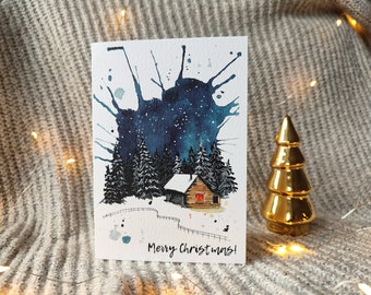 Christmas card -  Forest cottage in the starry night. A6 size textured card with hand-painted gold details.