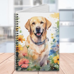 May include: A watercolor painting of a golden retriever dog sitting in a field of flowers. The dog is looking at the camera with a happy expression. The flowers are in shades of pink, yellow, and blue.