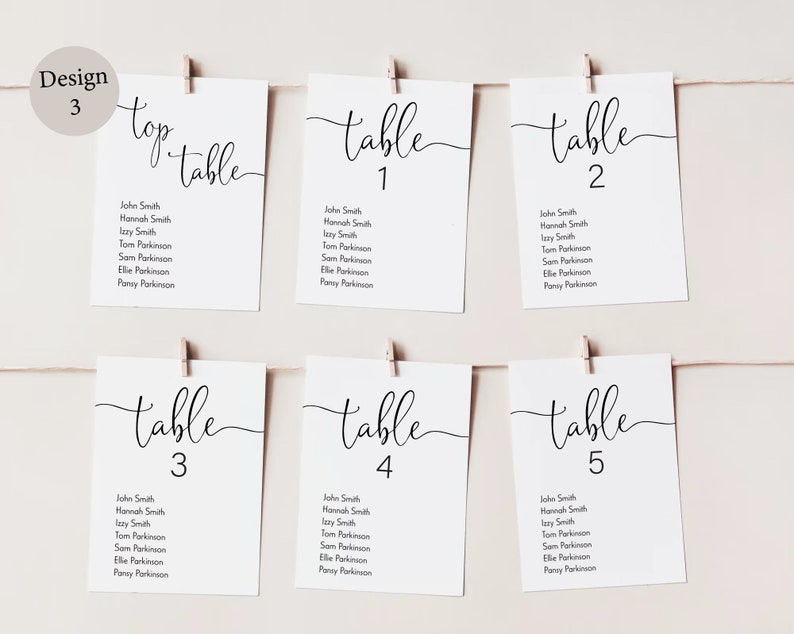 Peut inclure: Cartes blanches avec calligraphie noire listant les num&eacute;ros de table et les noms des invit&eacute;s. Les cartes sont accroch&eacute;es &agrave; une ficelle avec des pinces &agrave; linge. La carte du haut indique "top table".