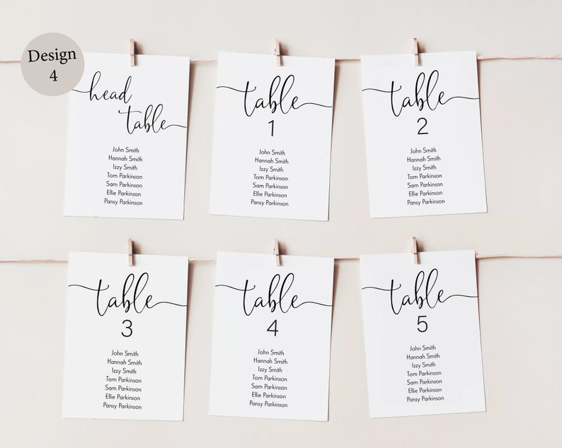 Peut inclure: Cinq cartes blanches avec du texte noir, chacune &eacute;tiquet&eacute;e "table" avec un num&eacute;ro de 1 &agrave; 5. Chaque carte liste un ensemble de noms pour un plan de table de r&eacute;ception de mariage.