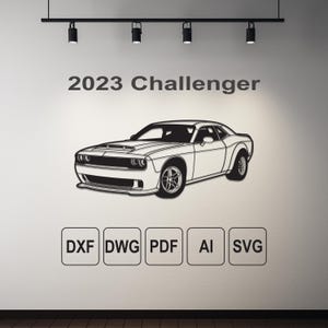 May include: A black and white line art illustration of a 2023 Dodge Challenger car. The image includes the text "2023 Challenger" and the file formats "DXF, DWG, PDF, AI, SVG".