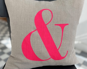 Beautiful natural linen cushion cover with neon pink ampersand