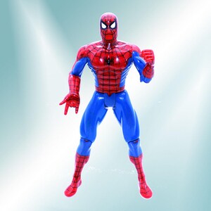 May include: A red and blue plastic action figure of Spider-Man. The figure is posed with its arms outstretched and its fists clenched.
