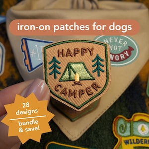 May include: A collection of iron-on patches for dogs, featuring a "Happy Camper" design with a tent and trees. The patches are in various colors, including green, brown, and tan. The image also includes text that says "28 designs bundle & save!"