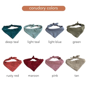 May include: A collection of eight corduroy dog bandanas in various colors, including deep teal, light teal, light blue, green, rusty red, maroon, pink, and tan. Each bandana is triangular with a tie closure.