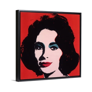 Pode incluir: Retrato pop art de uma mulher com cabelo preto, lábios vermelhos e sombra de olhos turquesa sobre um fundo vermelho. A obra de arte é emoldurada em uma moldura quadrada preta.
