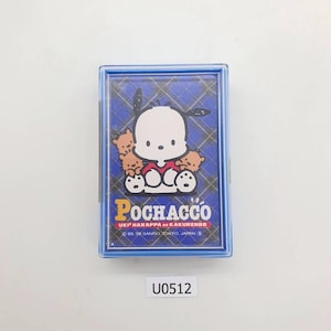 May include: A blue plastic case featuring a cartoon image of Pochacco with small brown bear-like characters. The case has a blue plaid background and the word "Pochacco" in yellow. The text "UKI² HARAPPA or KAKURENBO" is also visible.