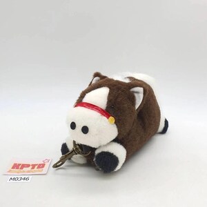May include: A plush horse keyring featuring brown and white fur, a red strap across the nose with a small yellow accent, and a bronze-coloured metal lobster clasp. A small white tag with the red text KPTD and black text M0346 is visible nearby.