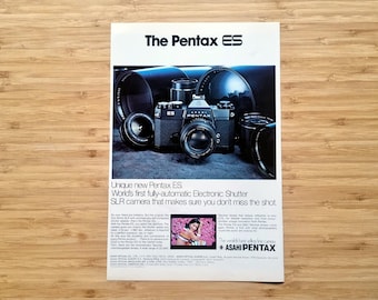 Anuncio de revista de cámara réflex vintage, anuncio del obturador electrónico Pentax ES, arte mural fotográfico de los años 70