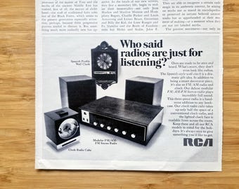 May include: An advertisement featuring vintage RCA radios and clocks. The image showcases a Spanish-style wall clock, a clock radio cube, and a modular FM/AM-FM stereo radio, all in a black and white aesthetic.