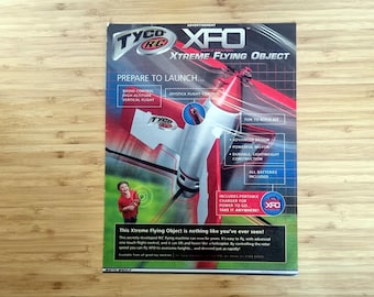 Pubblicità di giocattoli vintage anni 2000, Tyco R/C XFO "Xtreme Flying Object", annuncio pubblicitario stampato sulla rivista Mattel del 2003, originale arte murale da collezione retrò RC da 11,5x9"
