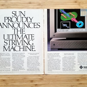 May include: An advertisement for Sun Microsystems, featuring the text "SUN PROUDLY ANNOUNCES THE ULTIMATE STRIVING MACHINE." The ad includes an image of a computer monitor displaying 3D graphics and a computer tower.