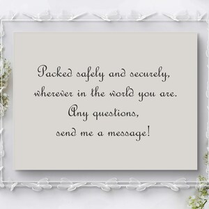 May include: A rectangular card with text in a decorative frame. The text reads: "Packed safely and securely, wherever in the world you are. Any questions, send me a message!" The frame is white with butterfly accents.