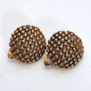 Pendientes de clip vintage en tono dorado