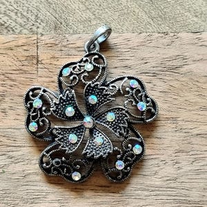 Vintage Rhinestone Pendant | Ornate Black Metal Flower Charm| Statement Jewelry | Antique Style Accessory | Gift for Her