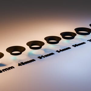 May include: A collection of black lens hoods in various sizes, ranging from 35mm to 77mm, arranged in a diagonal line. Each hood has a flared, circular design. The sizes are labeled in black text below each hood, against a gradient background.