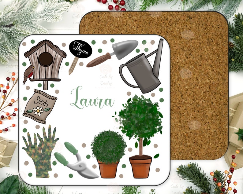 May include: A white square coaster with a gardening theme. It features a birdhouse, gardening gloves, a watering can, a pair of pruning shears, a bag of seeds, a small potted tree, a small potted bush, and a sign that says "Thyme". The name "Laura" is written in green cursive lettering.