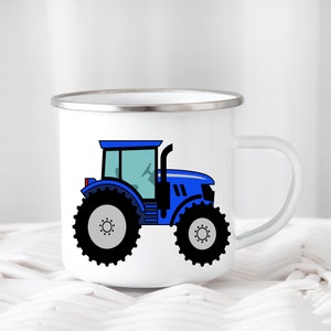 May include: A white enamel mug with a blue tractor design. The tractor has black wheels and a black outline.