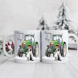 May include: Two white ceramic mugs with a festive design. Each mug features a green tractor decorated with Christmas lights, a black and white dog, and the names "Harry & Skye" in elegant script. The mugs are set against a snowy winter backdrop.