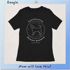 May include: Black t-shirt with a white graphic of a beagle constellation. The graphic includes the text "Constellation Beagleus Aroomium" and "Baying Beagle".