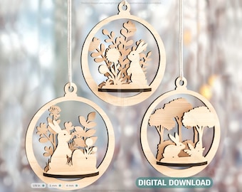 May include: Three wooden ornaments shaped like spheres with a bunny rabbit and floral designs inside. The ornaments are hanging from white string. The background is a blurred image of a window with light shining through.