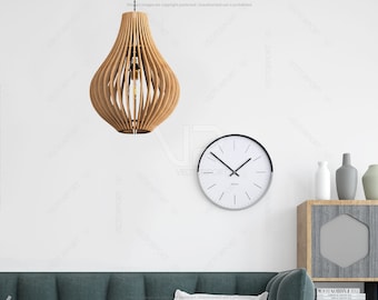 May include: A white wall with a wooden pendant light, a clock with black hands and a black rim, and a wooden shelf with three vases. The vases are gray, white, and beige.