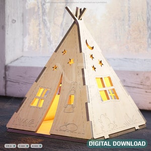Puede incluir: Una luz nocturna de madera en forma de tipi con un diseño recortado de estrellas, una luna creciente y una ventana. El tipi está iluminado desde el interior, creando un brillo cálido. DESCARGA DIGITAL