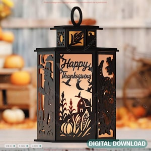 May include: Black laser-cut lantern with a handle, featuring Thanksgiving-themed silhouettes. The design includes a farmer, flying birds, a barn, pumpkins, and the words "Happy Thanksgiving". The lantern is designed to hold a light source.