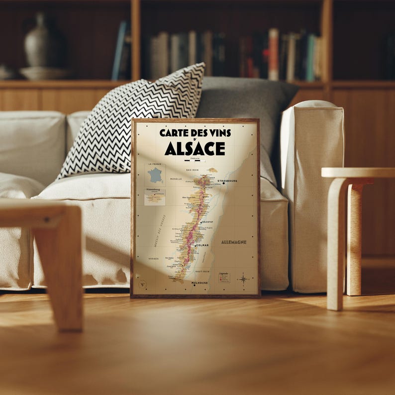 May include: A vintage-style map of the Alsace wine region in France. The map is printed on a cream-colored background with brown borders and text. The map shows the different wine-producing areas of the region, with labels in French.