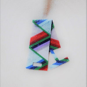 May include: A colorful beaded bracelet with a geometric pattern in shades of blue, green, red, and purple.