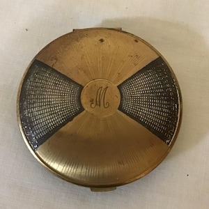 Vintage Stratton Gold Tone & Black Enamel Art Deco Ladies Compact complete with puff and rouge.