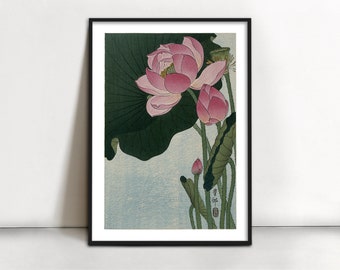 May include: A vintage Japanese woodblock print depicting a pink lotus flower with green leaves. The print is framed in black and has a Japanese signature in the bottom right corner.
