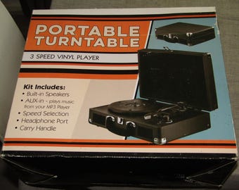 Tocadiscos portátil negro de 3 velocidades en perfecto estado.