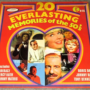 May include: A vintage vinyl record album cover titled "20 Everlasting Memories of the 50's." The cover is red with a heart-shaped design containing images of singers. Includes Liberace, Percy Faith, Johnny Mathis, Doris Day, Johnny Ray, and Tony Bennett.