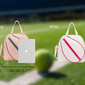 May include: Two tennis racket bags, one pink and one white, with pink accents. Both bags are 15.7 inches tall and 5.1 inches wide. The pink bag is shown with a laptop inside.