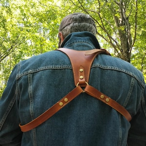 Handcrafted leather single-camera strap with adjustable and comfortable design, a Personalized camera harness, and a Photographer gift