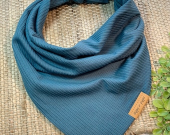 May include: A dark blue ribbed bandana with a brown leather tag that says "Happy & Co."
