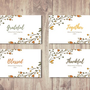 May include: Four printable Thanksgiving cards with floral designs and the words "Grateful", "Together", "Blessed", and "Thankful". Each card includes the text "Williams Family Thanksgiving - 2021 - "
