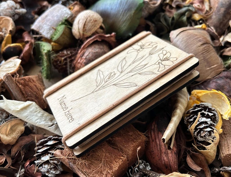 a book sitting on top of a pile of leaves