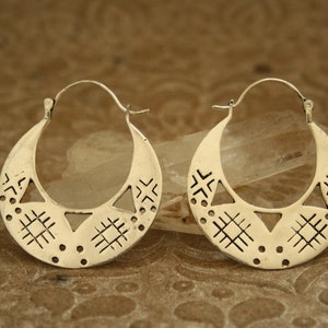 Large silver hoop earrings. They are large but light, comfortable to wear.