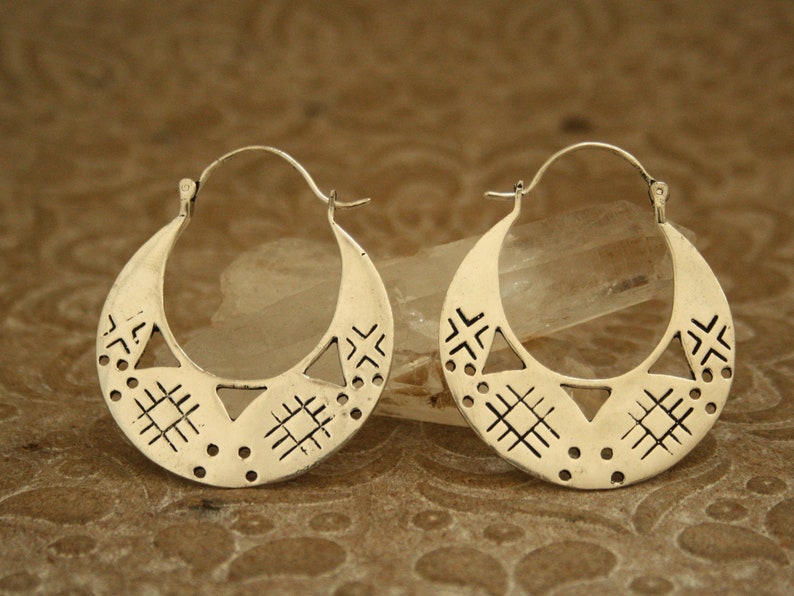 Large silver hoop earrings. They are large but light, comfortable to wear.