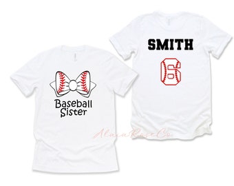 May include: Two white t-shirts, one with a baseball bow and the text "Baseball Sister", and the other with the text "SMITH" and the number "6" with a baseball design.
