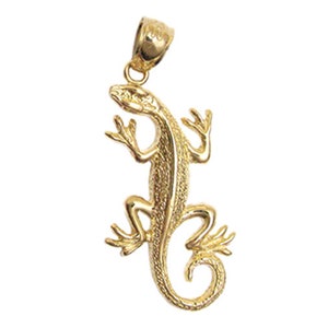May include: A gold-toned lizard pendant charm. The lizard is depicted in a curled position with its tail wrapped around its body. The pendant has a loop at the top for attaching to a chain or necklace.