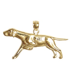 May include: A gold-colored pendant in the shape of a running dog. The dog is in a mid-stride pose with its head turned to the side. The pendant is detailed and realistic.