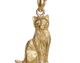 May include: A gold-colored cat charm pendant. The cat is sitting with its tail curled around its legs. The charm is made of metal and has a detailed design.