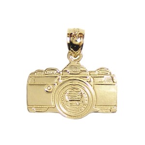 May include: A gold-tone camera charm pendant. The charm is detailed with a lens, buttons, and a textured surface.