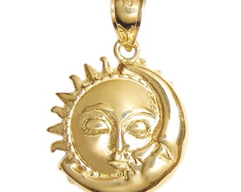 May include: A gold pendant charm featuring a sun and moon design. The sun has a face and the moon is a crescent shape.