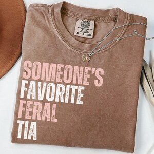 Comfort Colors Pregnancy Reveal to Sister Auntie Shirt, Someone&#39;s Favorite Feral Tia Shirt,  Feral Aunt Shirt, Pregnancy Reveal Gift